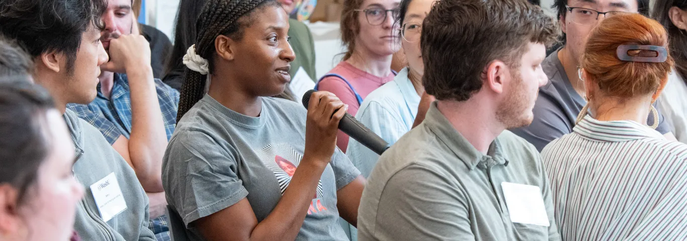 "audience member asking a question"