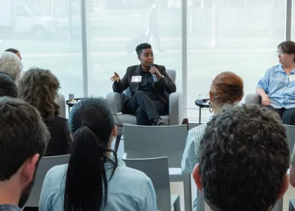 "panelist with microphone"