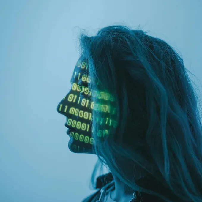 "female profile with data superimposed onto her face"